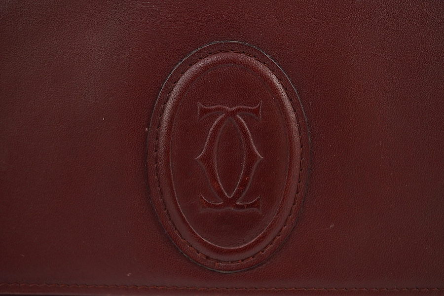 A Must de Cartier lady's leather shoulder bag in bordeaux